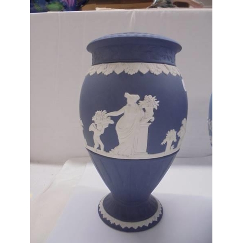 1265 - Two Wedgwood Jasper ware vases, one in dark blue and the other in pale blue.