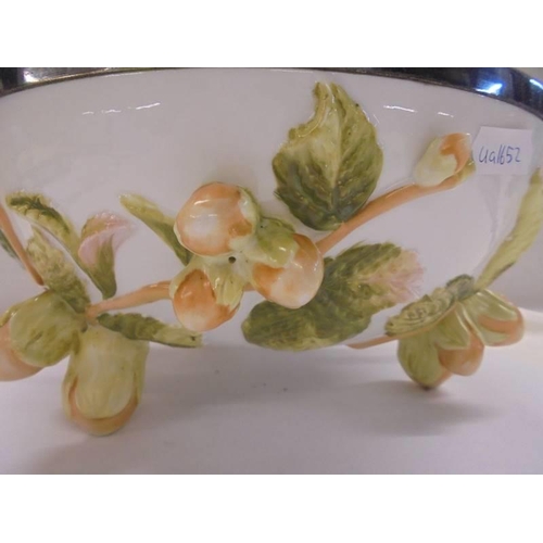 1279 - A ceramic bowl featuring oak leaves and acorns with plated rim, 28 cm diameter.