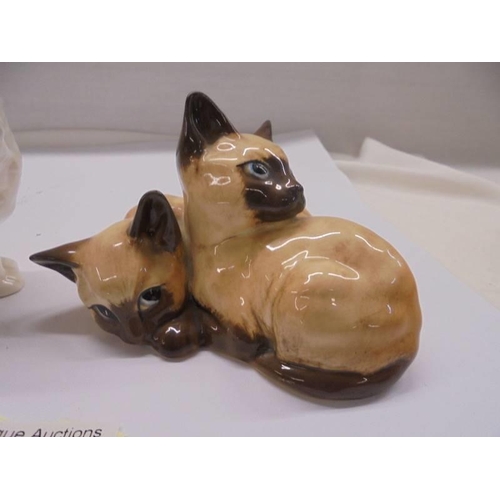 1284 - A Goebel cat figure and a Beswick figure of two Siamese kittens marked 1296.