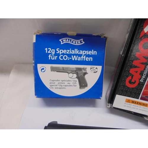 1238 - A boxed Gamo precision airgun with capsules.