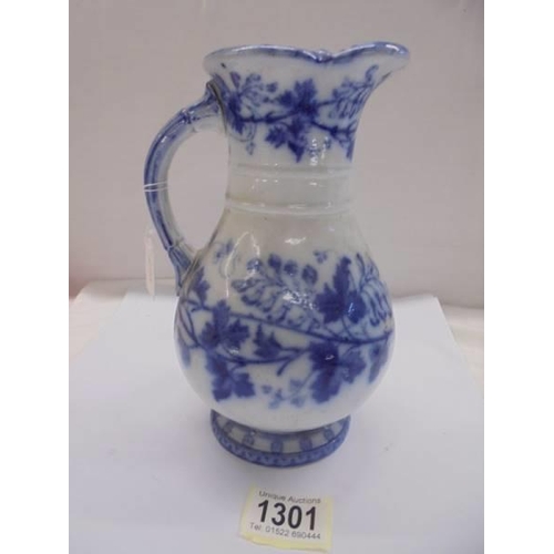 1301 - An early Victorian blue and white jug with lozenge mark.