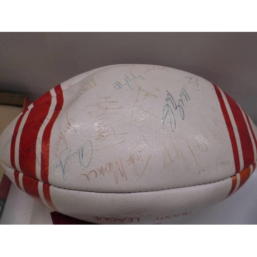 1302 - A signed Aston Villa 1990/01 season football, A signed Wigan Rugby league ball and a Wigan tie.