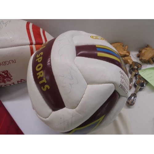 1302 - A signed Aston Villa 1990/01 season football, A signed Wigan Rugby league ball and a Wigan tie.