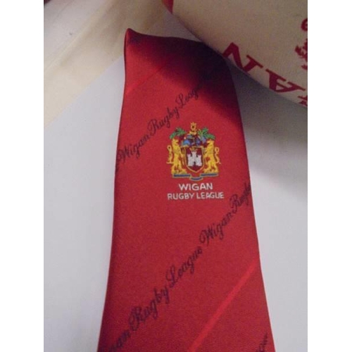 1302 - A signed Aston Villa 1990/01 season football, A signed Wigan Rugby league ball and a Wigan tie.