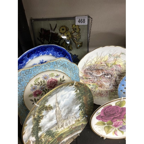 468 - A collection of hanging wall plates and a glass plaque