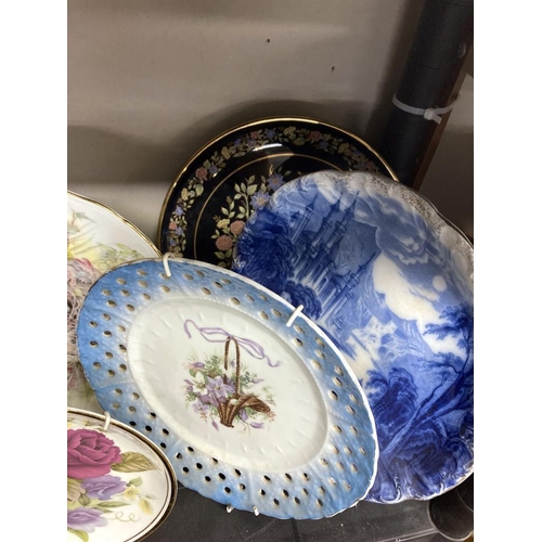 468 - A collection of hanging wall plates and a glass plaque