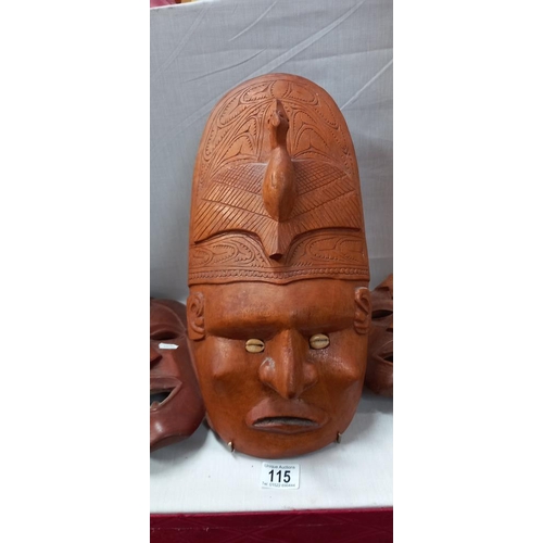 115 - 7 Carved wooden tribal face masks