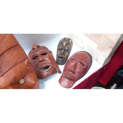 115 - 7 Carved wooden tribal face masks