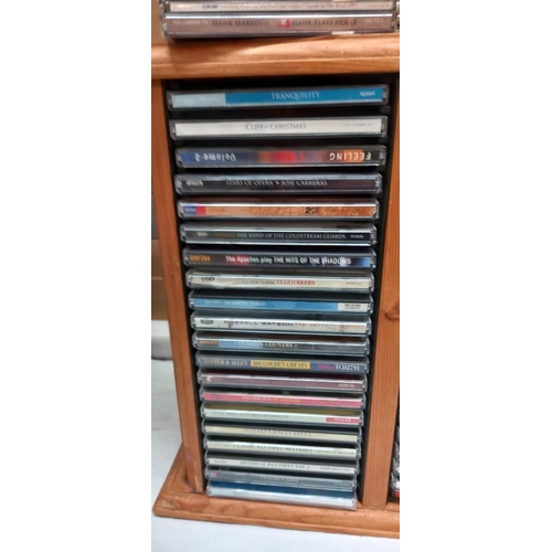 152 - A pine CD rack & contents COLLECT ONLY