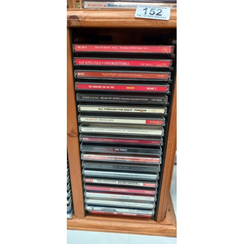 152 - A pine CD rack & contents COLLECT ONLY