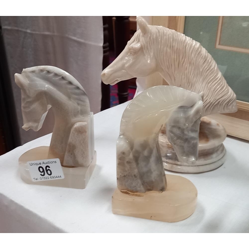 96 - A pair of polished stone horse head book ends & 1 other resin bust on stone