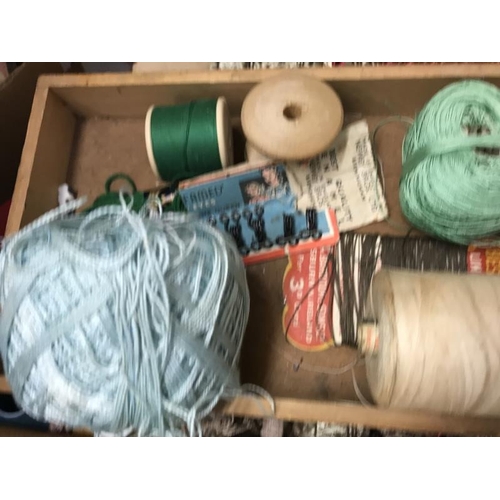 607 - A quantity of sewing threads and haberdashery items including wooden shuttle and darning mushroom