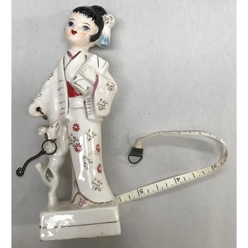 668 - Vintage ceramic Japanese girl figurine tape measure 1950's