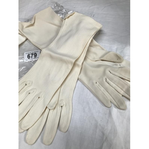 679 - Three pairs of evening gloves, White . A/F