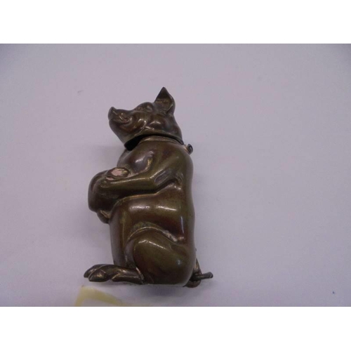 1242 - A Victorian 'Go-to-bed' brass vesta in the form of a pig.