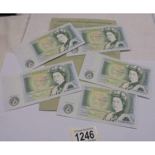 1246 - Five mint English one pound notes in a Memento folder.