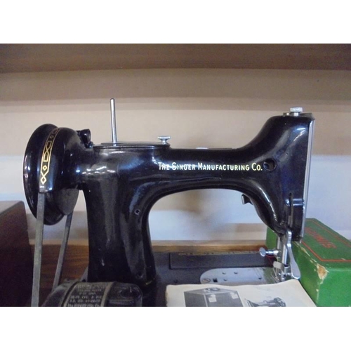 1311 - A Singer Featherweight 222K sewing machine with accessories (no case).