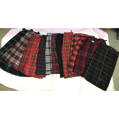 729 - 12 Tartan Skirts. Various sizes & colours