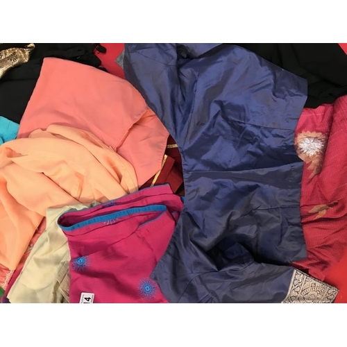 714 - A large quantity of Sari's and Sari related clothing