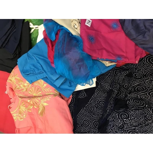 714 - A large quantity of Sari's and Sari related clothing