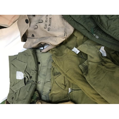 720 - Quantity of military uniform including bags