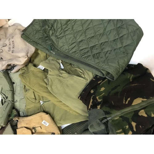 720 - Quantity of military uniform including bags