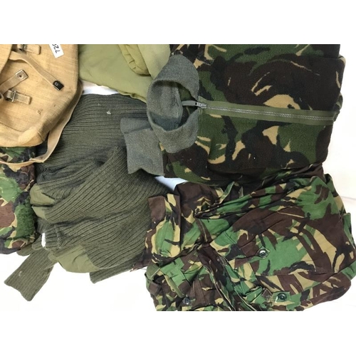 720 - Quantity of military uniform including bags