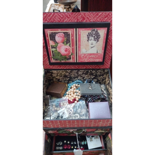 284 - A floral decorated cardboard jewellery box in the form of a cabinet