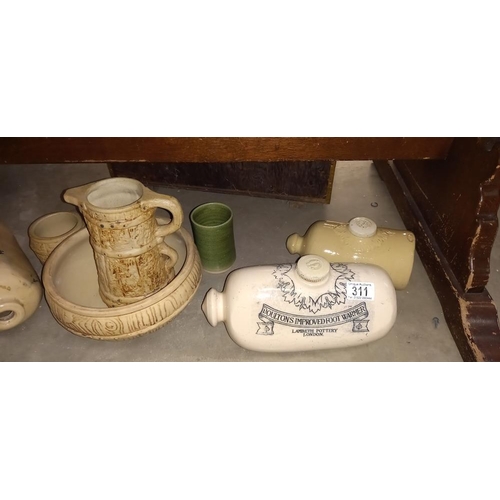 311 - A Doulton Lambeth stone ware hot water bottle & Other footwarmers & Jugs etc