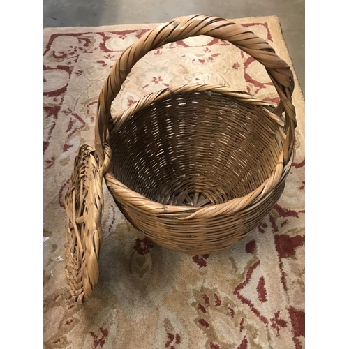 754 - Two wicker baskets and quantity of curtains. White with blue flower