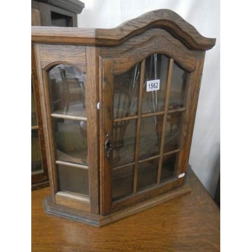 1562 - An oak glazed collector's display cabinet. COLLECT ONLY.