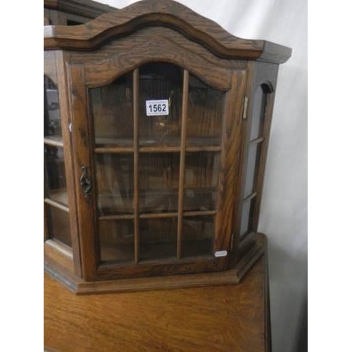 1562 - An oak glazed collector's display cabinet. COLLECT ONLY.