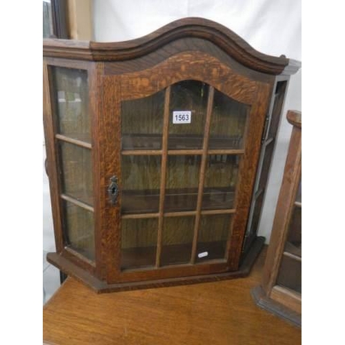 1563 - An oak glazed collector's display cabinet. COLLECT ONLY.