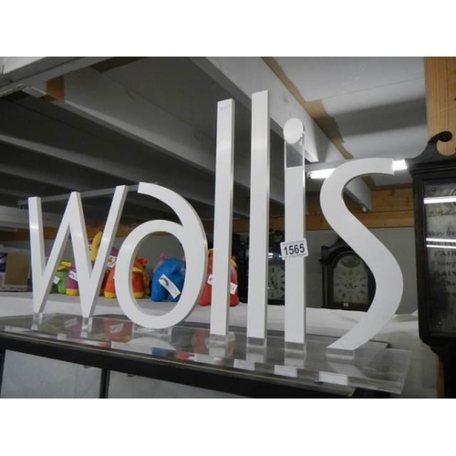 1565 - An Acrylic 'Wallis' shop display sign, COLLECT ONLY.