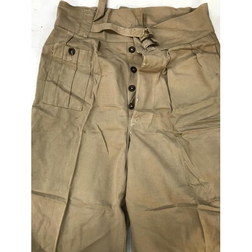 785 - Flight suit and pair of tan coloured shorts