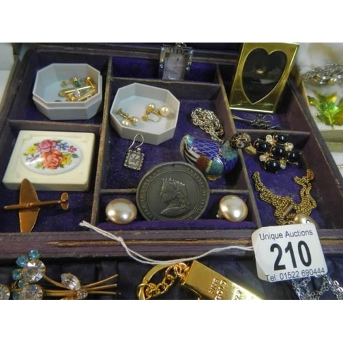 210 - An unusual jewellery box with a mixed lot of costume jewellery.