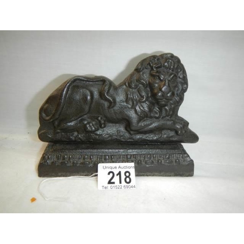 218 - An early cast iron lion doorstop.