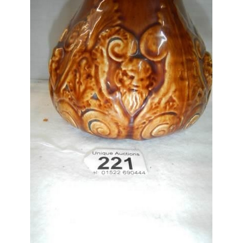 221 - A good early 20th century crackle glaze jug with figural handle.