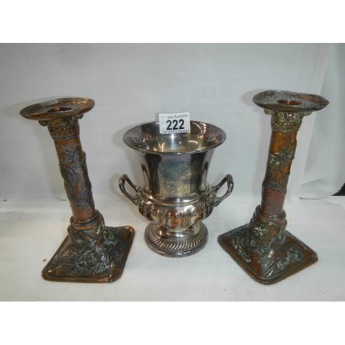 222 - A pair of early 20th century plated candlesticks and a twin handled urn.