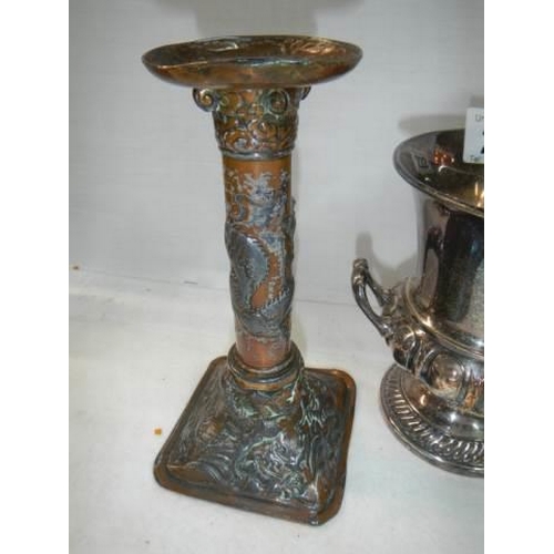 222 - A pair of early 20th century plated candlesticks and a twin handled urn.