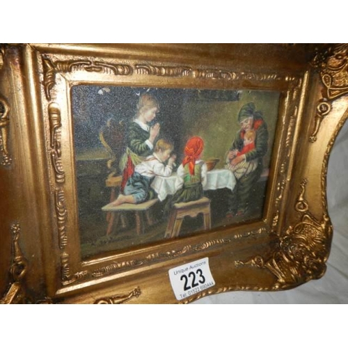 223 - A gilt framed dining room scene.