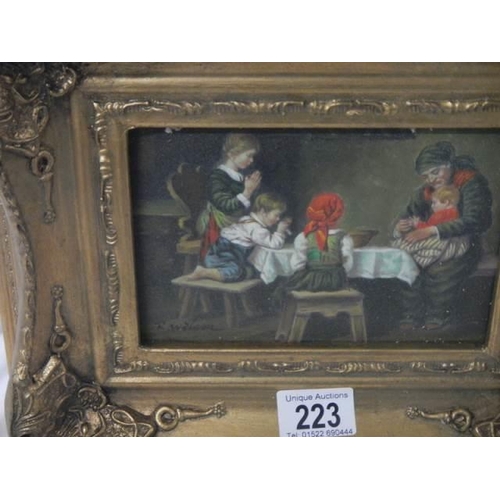 223 - A gilt framed dining room scene.