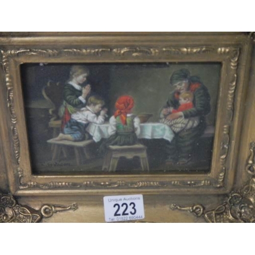 223 - A gilt framed dining room scene.