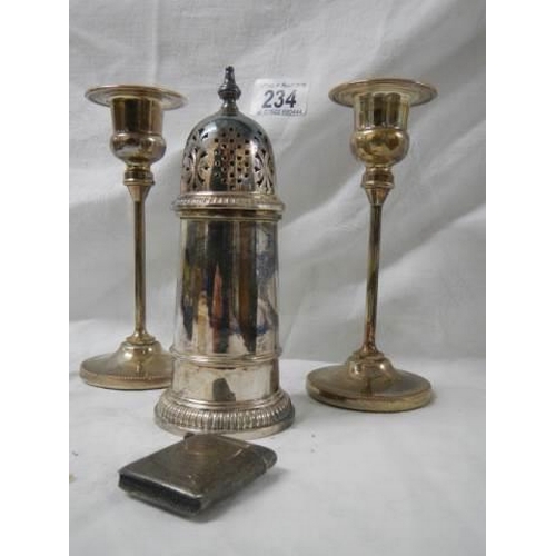 234 - A pair of silver plate candlesticks, sugar sifter and match box.