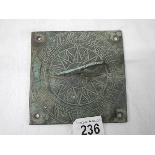 236 - An old brass sundial.