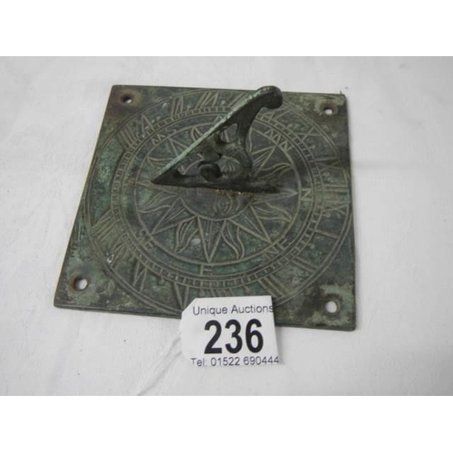 236 - An old brass sundial.