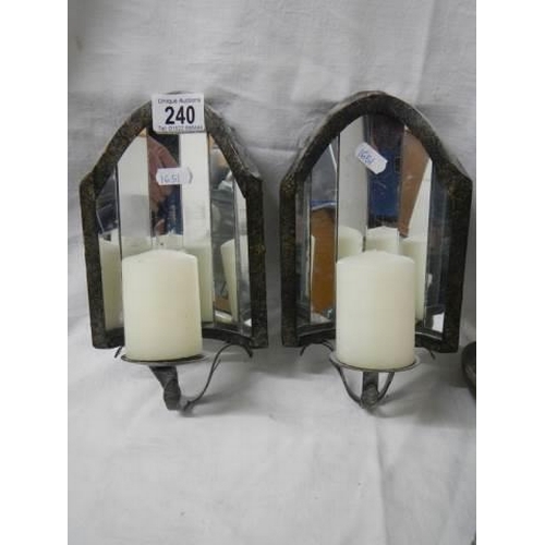 240 - A pair of wall mounting candle holders with mirrors in back.