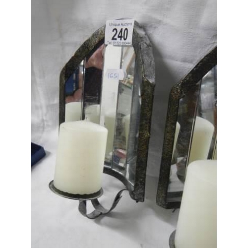 240 - A pair of wall mounting candle holders with mirrors in back.