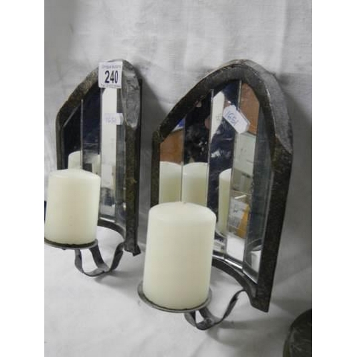 240 - A pair of wall mounting candle holders with mirrors in back.