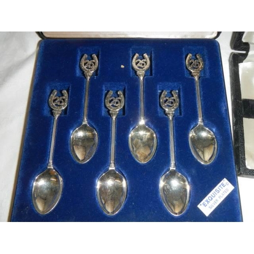 244 - Two cased sets of teaspoons.